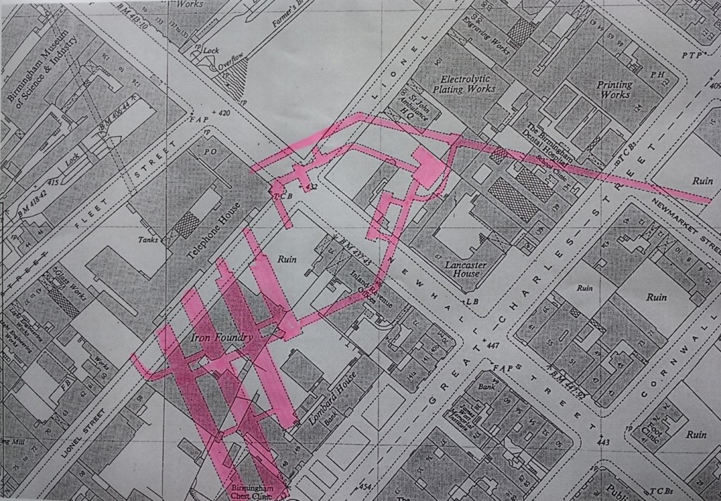 Close up of an ordnance survey map showing where Newhall St. crosses with Great Charles St. Building outlines are named and marked. Superimposed over these is a dotted line coloured pink which shows which buildings the tunnels pass under. The tunnels emanate from the Telephone House stretching  under the building on the opposite side of Lionel Street, Newhall Street and Great Charles Street.