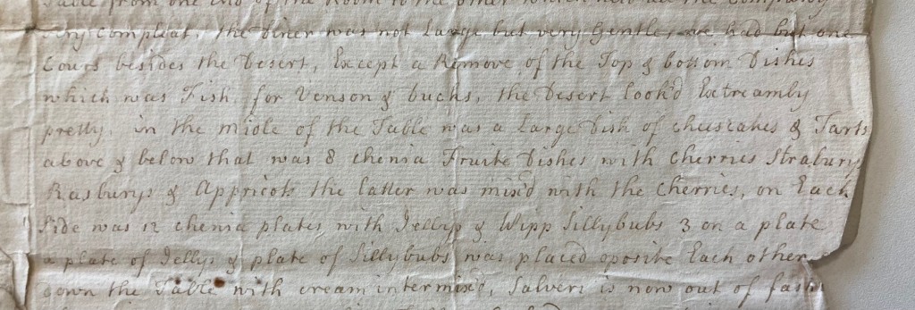 a close up of a piece of aged paper with folds and tears on the edge with delicate old fashioned handwriting. The transcript is in the body of the article