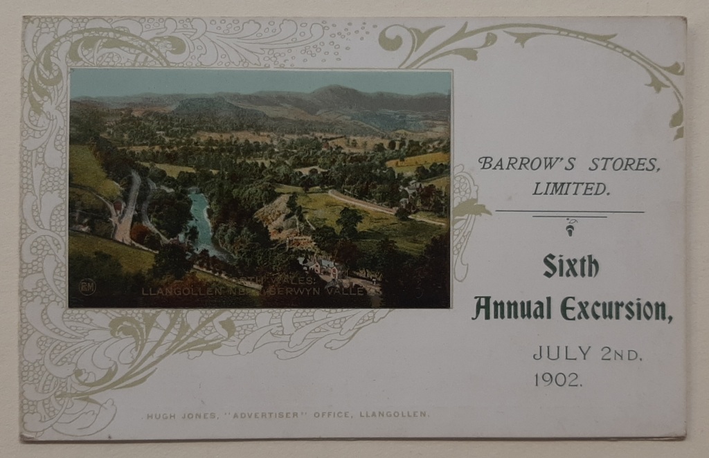 A card with a photograph of countryside and mountains on the left-side and text on the right-hand side. 